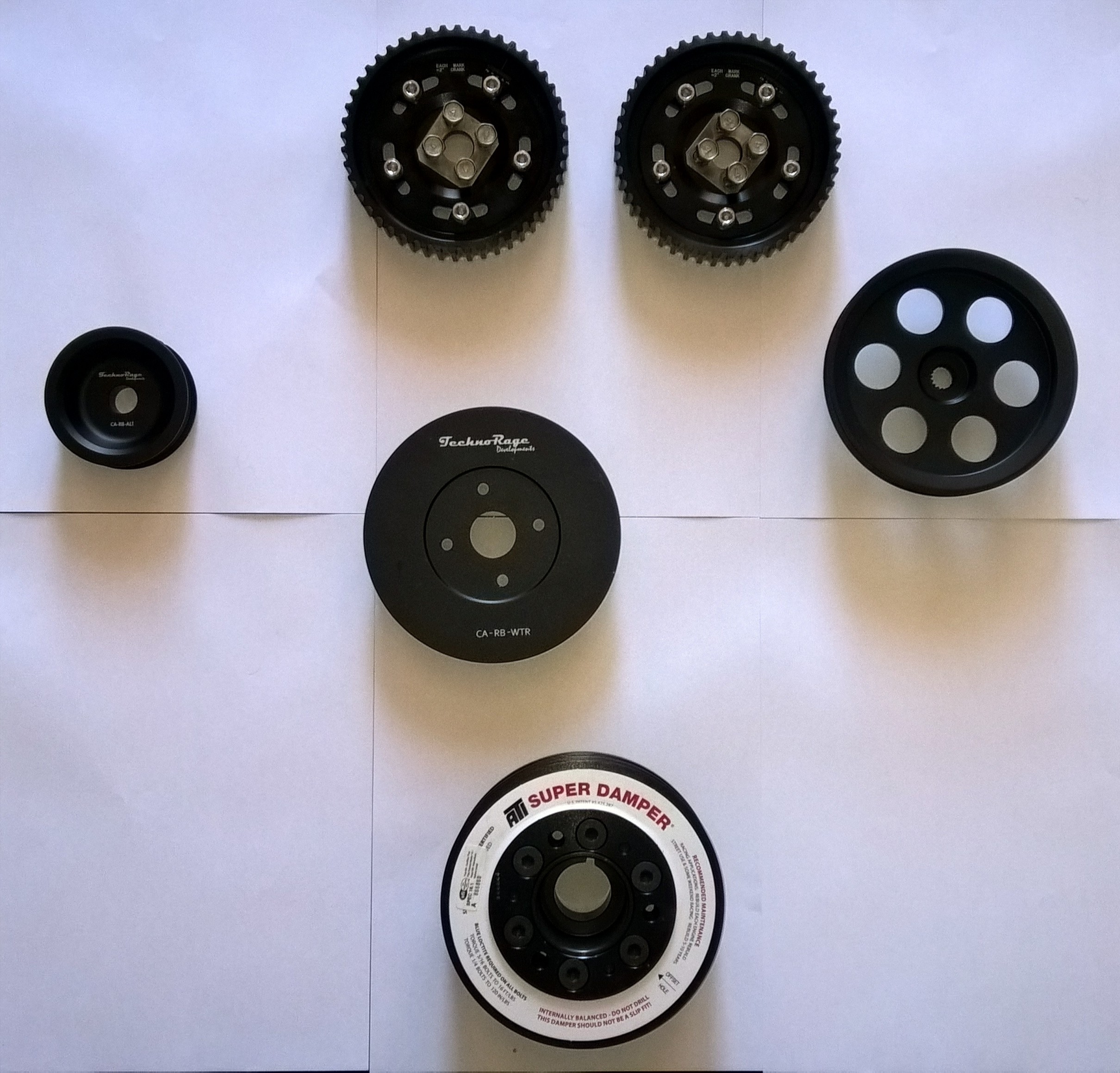 Custom pulleys and adjustable cam gears